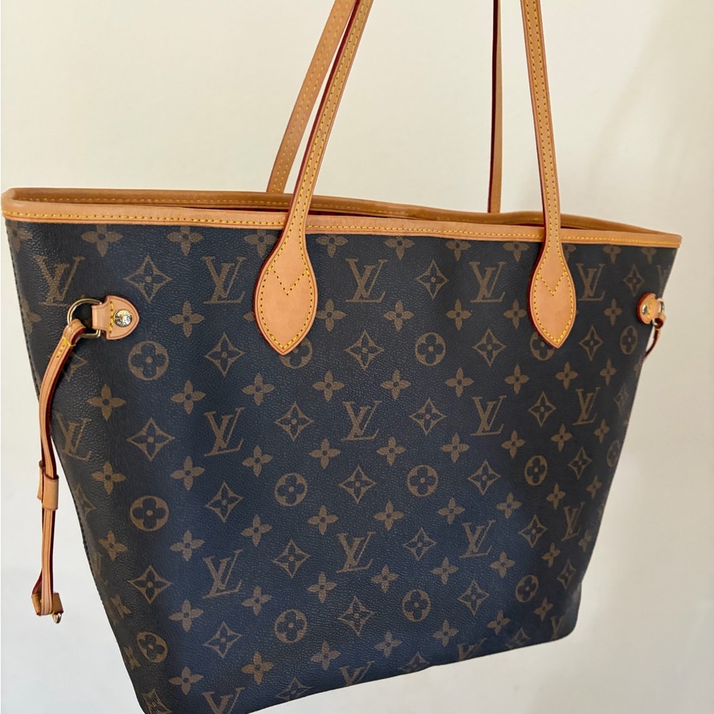 Elegant style and in lightly used brown pattern tote bag